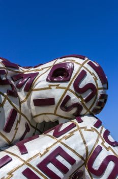 The modern tired sculpture against blue sky