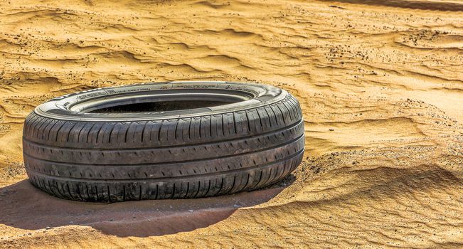 dropped tyre in desert from Oman