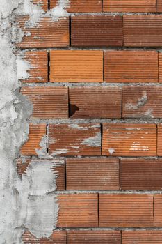 Backdrop of large bricks with irregular layers of concrete.