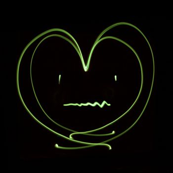 Heart patient generated by a beam of green light, with long exposure.