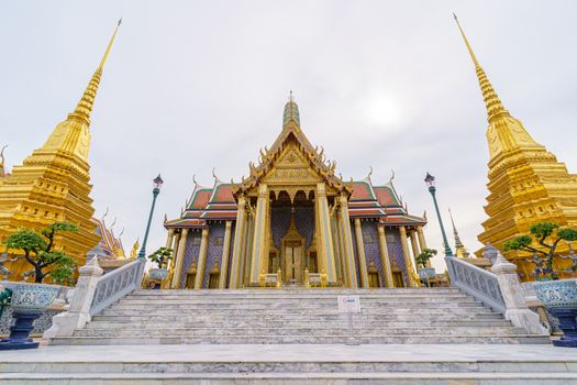 BANGKOK/THAILAND-JUNE 14: Wat Phra Kaew, wat Phra Si Rattana Satsadaram or Temple of the Emerald Buddha entrance that has beautiful to golden Hor Phra Rajkoramanusorn landmark in city on 06 14 2020