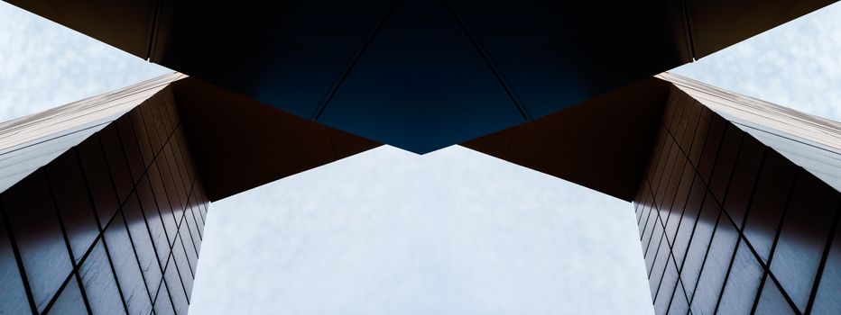 wall and arch of modern tall building against sky and clouds abstract architectural background