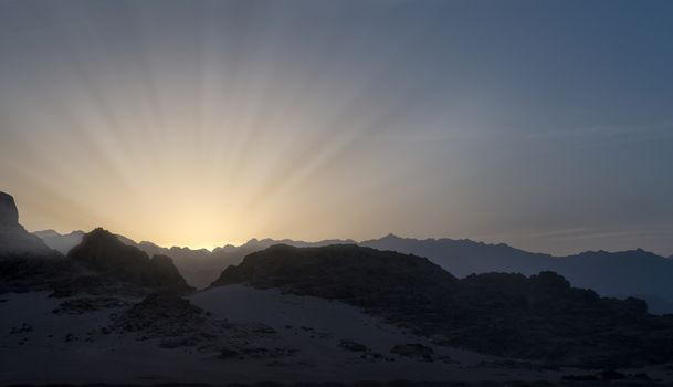 night desert landscape with rocky mountains and sunset sky with clouds in Sharm El Sheikh Egypt