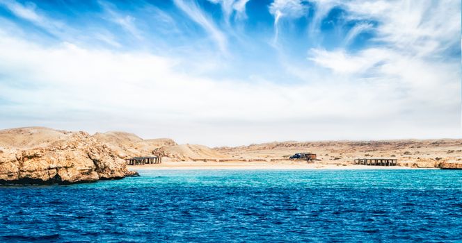 landscape rocky coast of the Red Sea and blue sky with clouds in Sharm El Sheikh Egypt