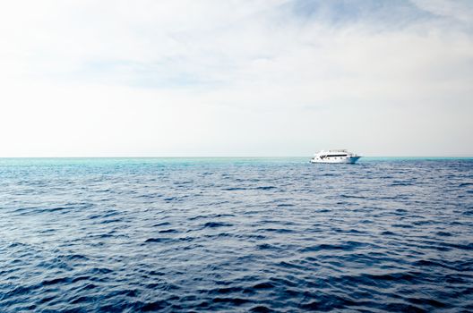 white cruise tourist boat on the background of the coast in the Red Sea in Sharm El Sheikh Egypt