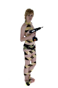 An attractive blonde woman standing with electric drill