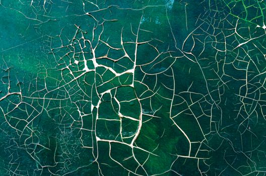 cracked paint on old picture close up abstract background art restoration pattern