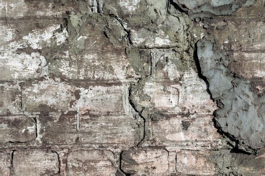 old stone brick rough dirty wall background pattern close up