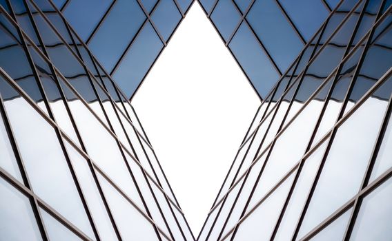 distorted reflection in the mirrored windows of a modern building abstract geometric color blue architectural background pattern