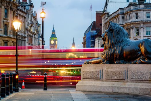 London Trafalgar Square lion and Big Ben tower at background, London, UK