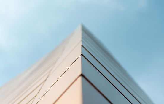 wall of a modern building on a background of blue sky abstract architectural background