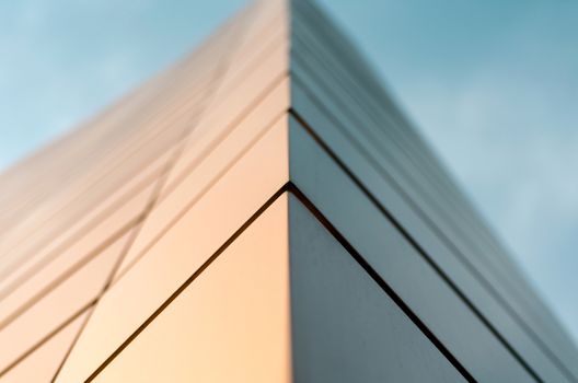 wall of a modern building on a background of blue sky abstract architectural background