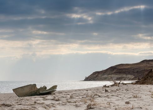 seascape with old broken boat