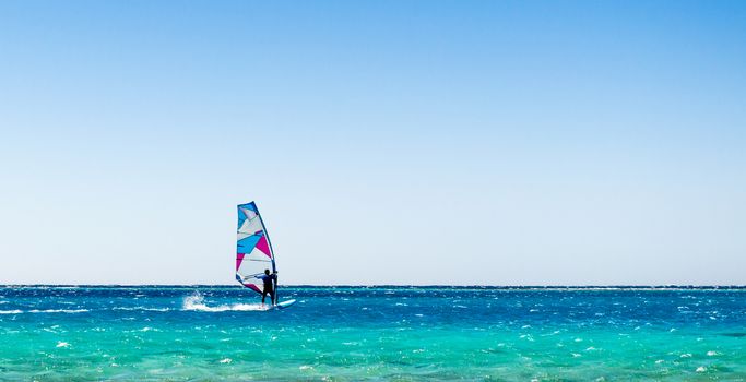 surfer rides in the Red Sea in Egyp