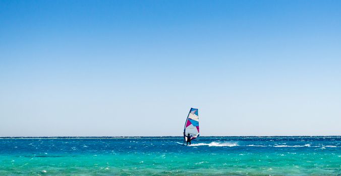 windsurfer rides in the sea in Egypt Dahab