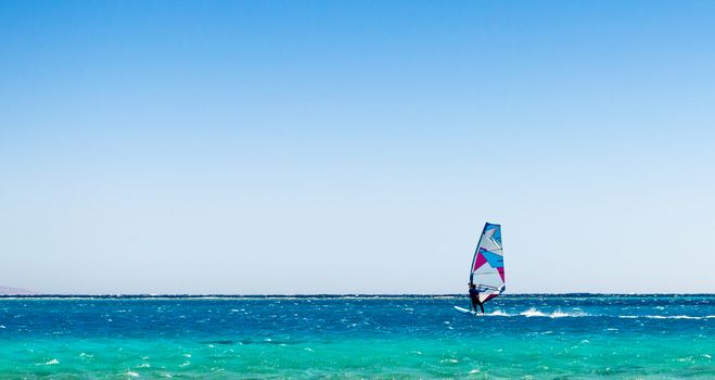 surfer rides in the Red Sea in Egyp