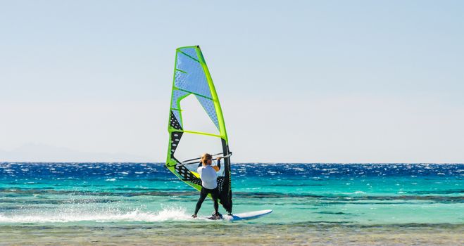 one surfer rides in the Red Sea against the background of a clear sky in Egypt Dahab