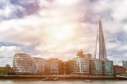 Business district with famous skyscrapers and landmarks at golden hour, London, UK