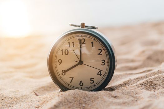 Selective focus of alarm clock on side table beside bed show 8 o'clock in the morning background.Time in life early bird person productive concept.