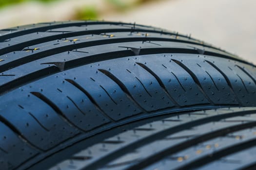 car tire, tread design with selective focus, close-up