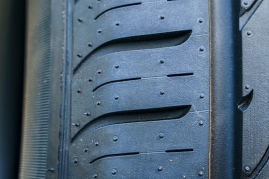 car tire, tread design with selective focus, close-up