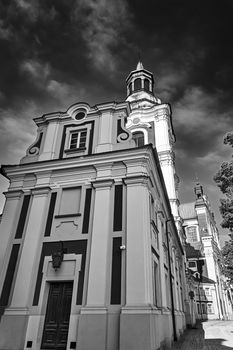 the Baroque building and Catholic Church with belfry in Poznan, black and white