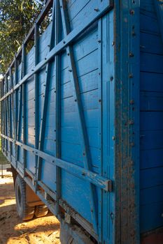 Blue truck used for transport of livestock between farms