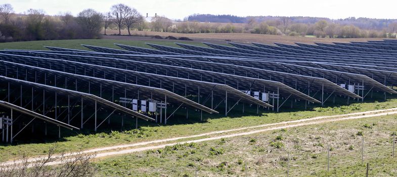 Generating clean energy with solar modules in a big park in northern Europe.