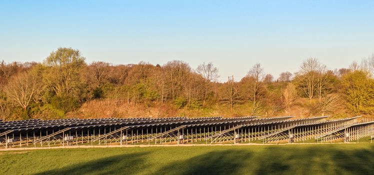 Generating clean energy with solar modules in a big park in northern Europe.