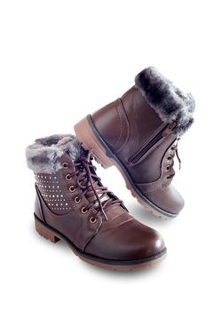 Comfortable and warm winter boots with gray fur inside with zipper and lace-up. Presented on a white background.