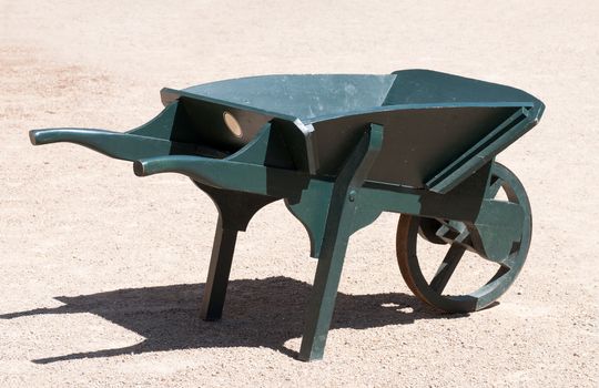 An old painted wooden wheelbarrow