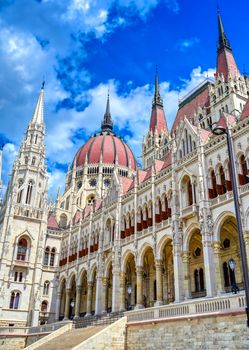 The Hungarian Parliament Building located on the Danube River in Budapest Hungary at sunset.