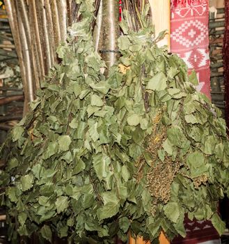 From birch branches woven two broom to steam in a Russian bath