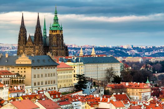 Prague Castle complex with gothic St Vitus Cathedral, Hradcany, Prague, Czech Republic. UNESCO World Heritage. Panoramic aerial shot from Petrin Hill.