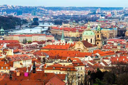 Panorama of the city Prague. Red tiled roofs of the houses in the old part of the city. Aerial view