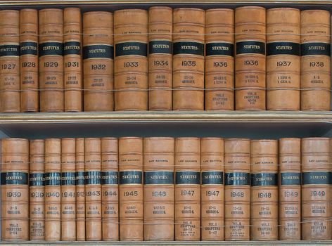 Rows of Statute legal books on shelves