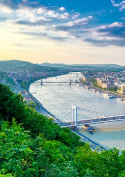 A view along the Danube River of Budapest, Hungary from Gellert Hill at sunset.