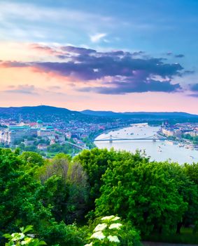 A view along the Danube River of Budapest, Hungary from Gellert Hill at sunset.