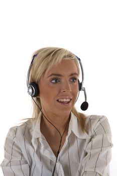 A pretty blonde female receptionist with headphones and microphone