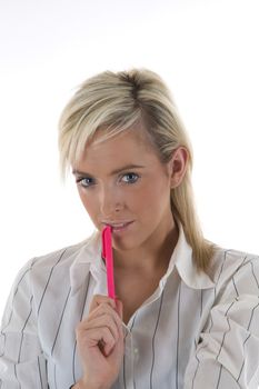 An attractive young secretary holding a pink pen