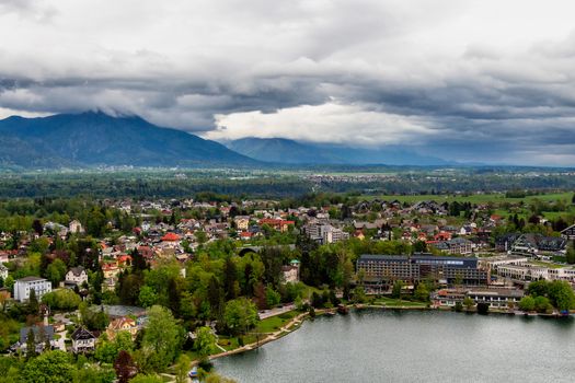Aerial view of Bled city with Alps mountains in the background, Slovenia.