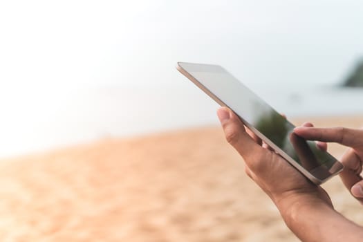 Woman hand using smartphone to do work business, social network, communication in public outdoor.