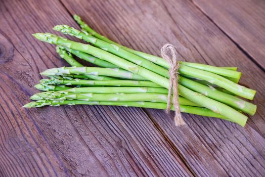 Asparagus on wooden background / Fresh green asparagus