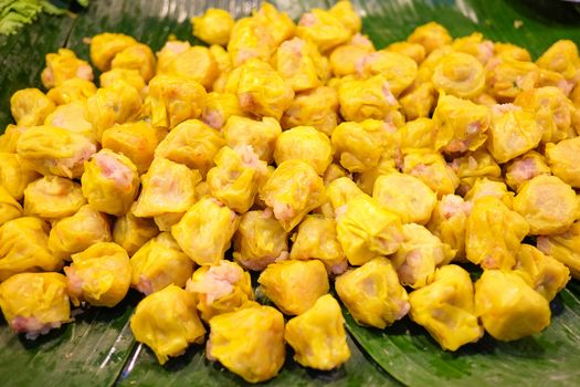 Chinese Steamed Dumpling on banana leaf in Fresh maket 