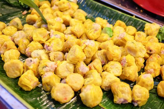 Chinese Steamed Dumpling on banana leaf in Fresh maket 