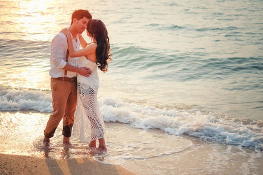 Happy couple relaxing and smile on the beach