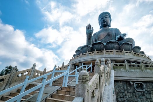 Front View of Tian Tan Giant Buddha in blue sky