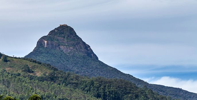 Adam's Peak tall conical mountain located in central Sri Lanka, rock formation near the summit, which in Buddhist tradition is held to be the footprint of the Buddha.