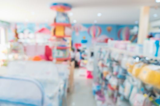 Blur modern baby and kid deparment  store shop bright tone abstract blurry background.