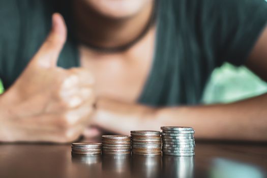 Business financial success concept. Gold coins on table and green nature bokeh background.Bullish market situation.